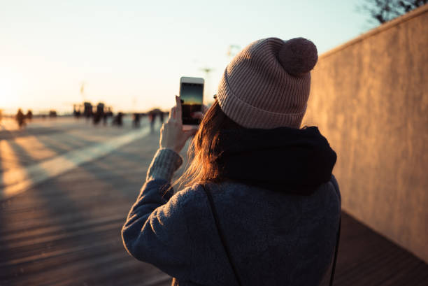 istock Back view of a young girl in hat 1347301214