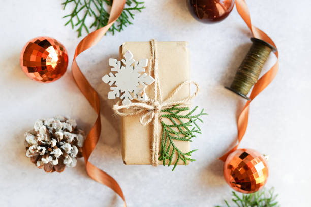 istock Christmas paper present on white background with winter craft decor 1347301472