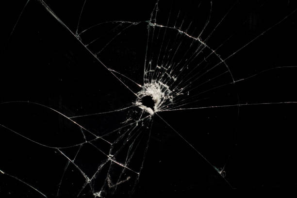 istock Broken glass with cracked on black background 1347301616