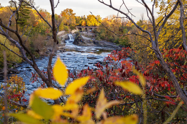 istock The Hog's Back Falls in Ottawa. Fall season in park with waterfalls and river 1347302361