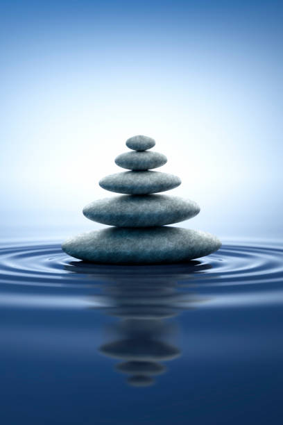 istock Stack of stones in water ripples and  reflections 1347303172