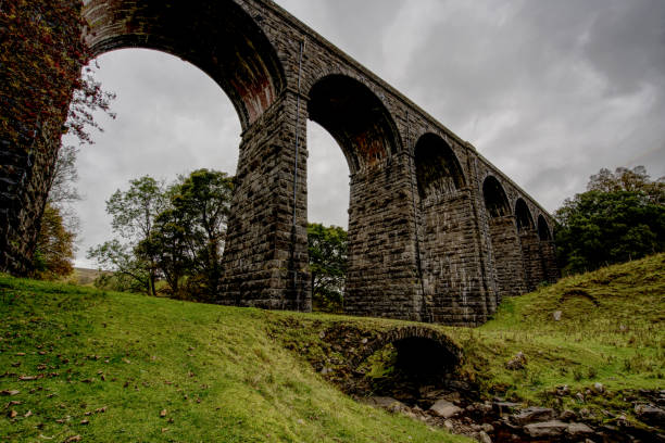 istock Dent Head viaduct with 18th century packhorse bridge, Cumbria, England, Britain 1347303389