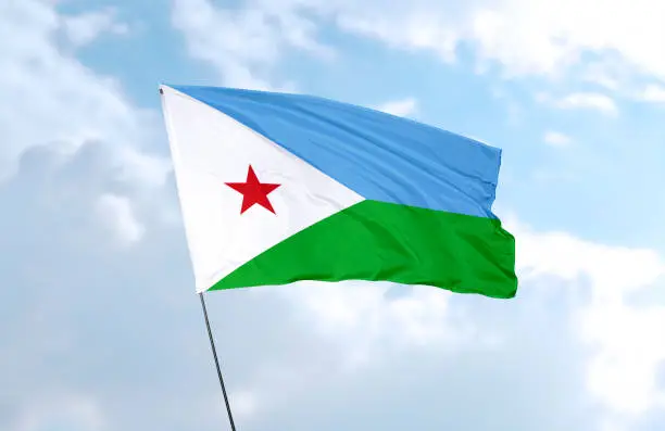 Flag of Djibouti in front of the blue sky