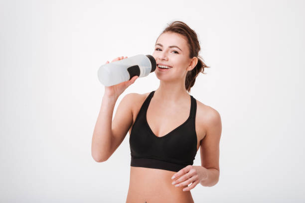istock Sporty young woman drinking water 1347304383