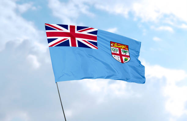 Flag of Fiji in front of the blue sky