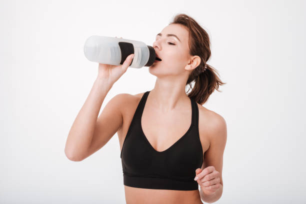 istock Fitness woman drinking water 1347305141