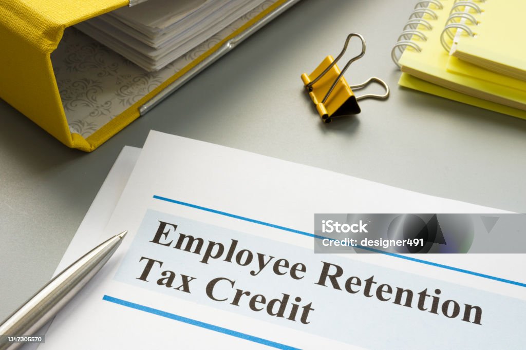 Employee retention tax credit papers and folder. Financial Loan Stock Photo
