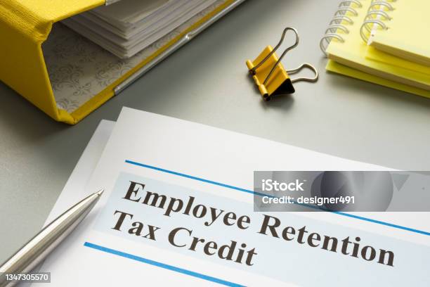 Employee Retention Tax Credit Papers And Folder Stock Photo - Download Image Now - Financial Loan, Employee Retention, Tax Form
