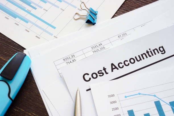 istock Calculations and cost accounting report with stack of papers. 1347306354
