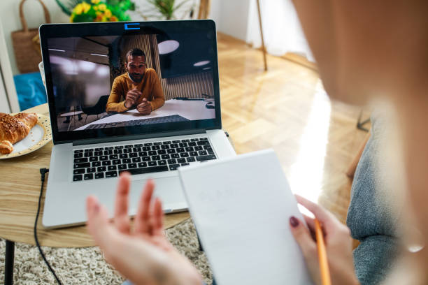 istock Young woman video chatting with her math professor 1347313655