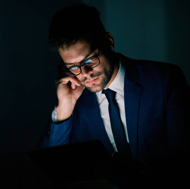 istock businessman laptop tablet night business computer man office technology light working young internet dark late deadline work 1347313912