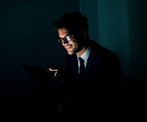 istock businessman laptop tablet night business computer man office technology light working young internet dark late deadline work 1347313971
