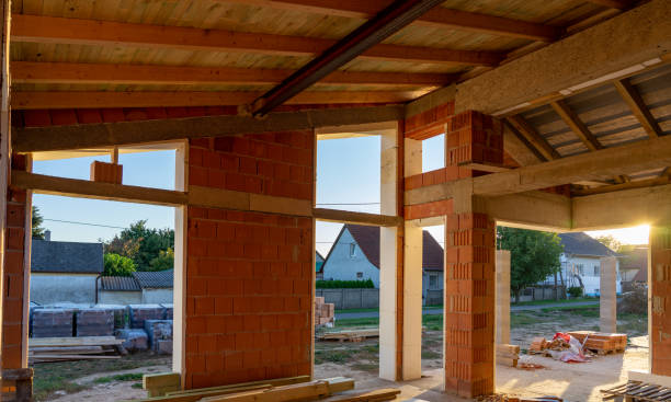 istock house under constraction with modern brick walls and holes for doors and windows . 1347314820