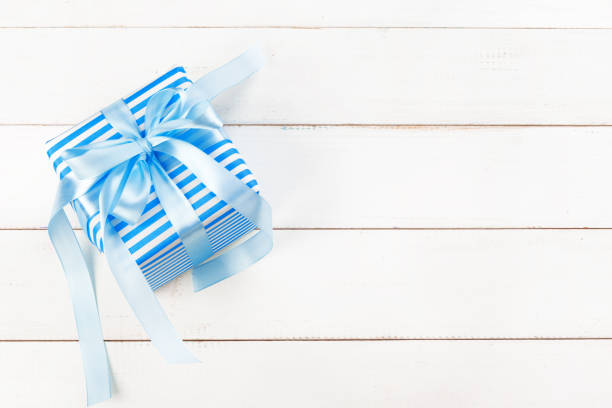 istock Gift boxes with ribbon on white table close up 1347314950