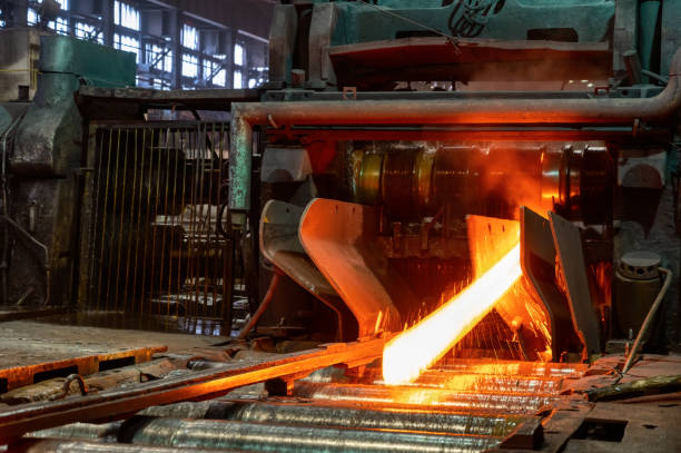 istock Red-hot metal billet on the roller table of a rolling mill 1347315231