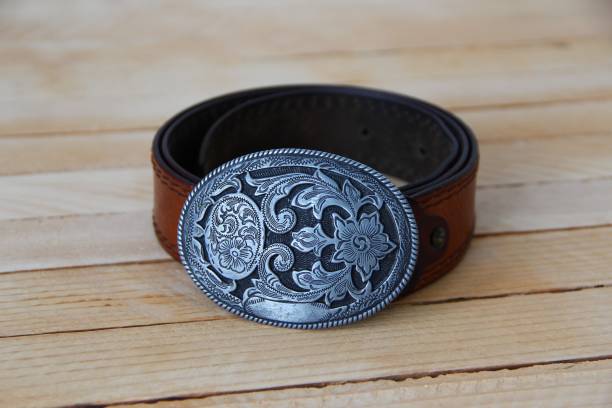 istock Leather cowboy belt on wooden background 1347315497