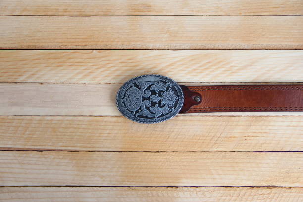 istock Leather cowboy belt on wooden background 1347316097