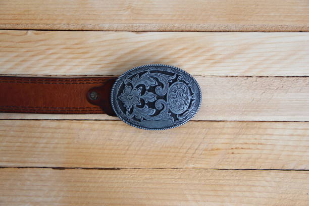 istock Leather cowboy belt on wooden background 1347316120