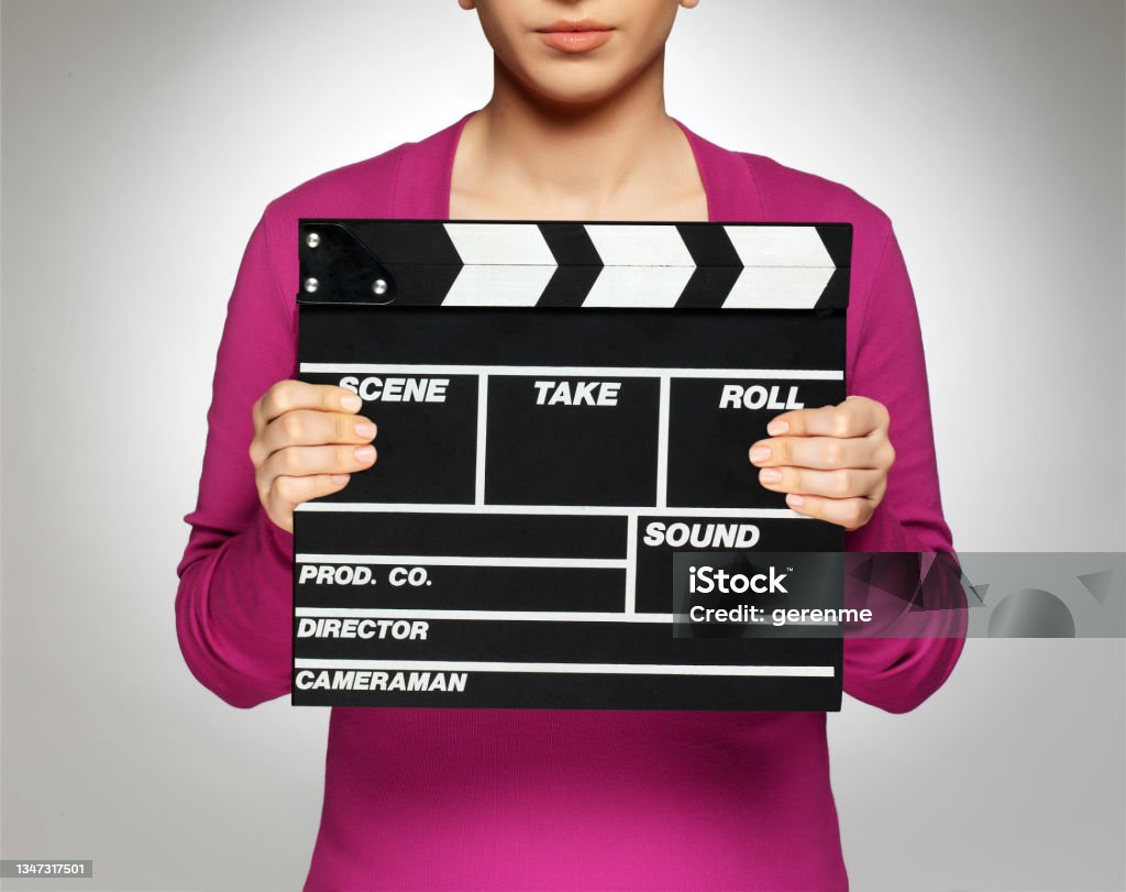 Clapboard Woman holding a film slate Film Slate Stock Photo