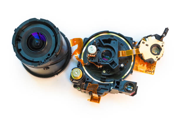 istock Disassembled lens of a digital camera isolated on white background. Lens image stabilization module. Magnetic stabilizing lens unit images 1347317526