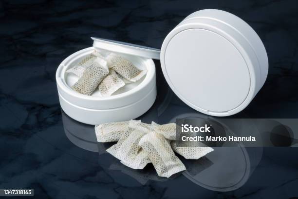 Closeup Of A White Swedish Snus Can And Portion Snuff Pouches Stock Photo - Download Image Now