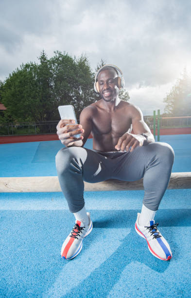 istock Male athlete using cell phone 1347321204