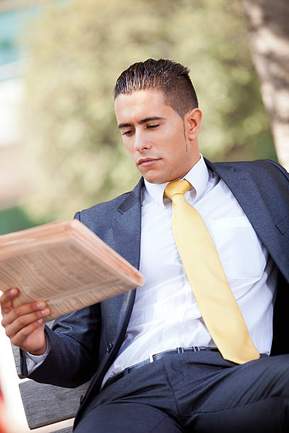 istock Businessman reading the newspaper 134732123