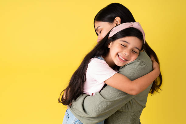 Adorable daughter hugging her mom