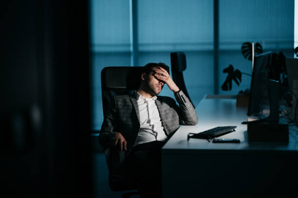 istock Young businessman tired at work 1347323783