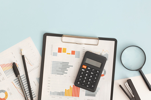 Magnifying glass on financial chart