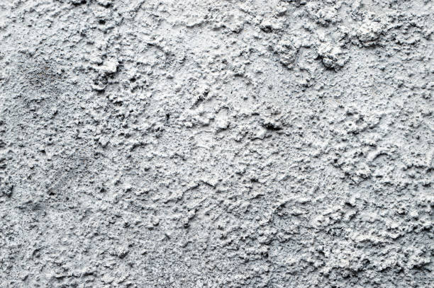 istock Gray rough concrete stone wall background, Copy space for interior design background, banner, wallpaper. Reconstruction 1347325527