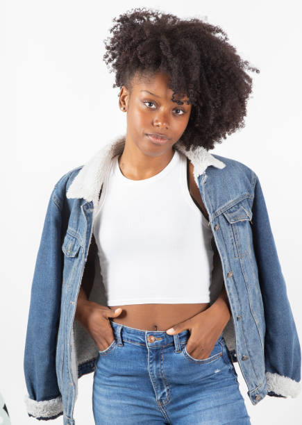 pretty afro american woman with denim clothes, on a white background, fashion and beauty pretty afro american woman with denim clothes, on a white background, fashion and beauty jeans shorts women latin american and hispanic ethnicity stock pictures, royalty-free photos & images