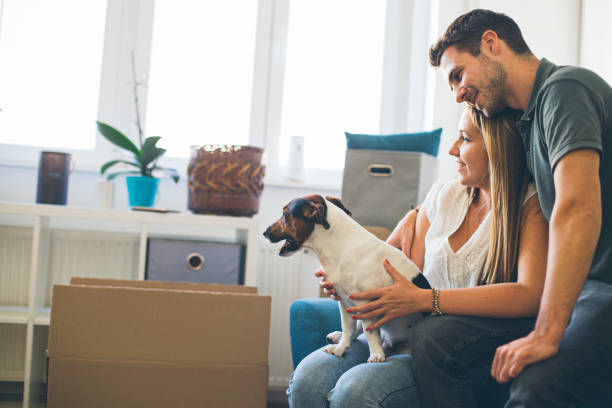 istock Young couple moving in into new apartment 1347328174