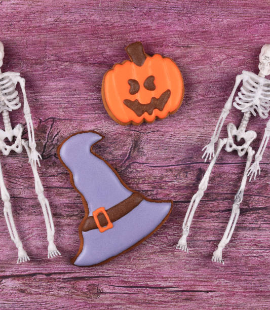 istock halloween gingerbread isolated on wooden background 1347328388