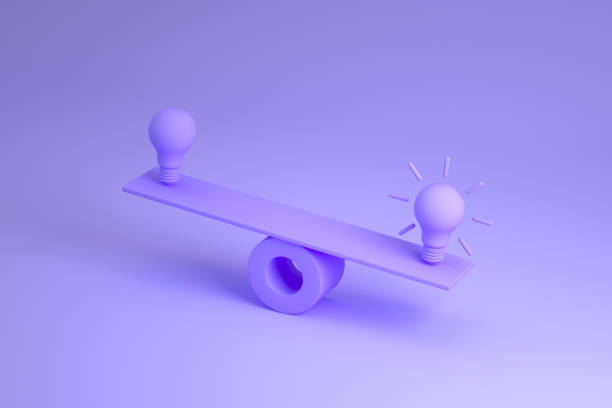 istock Light bulb on balance board, new idea background 1347329221