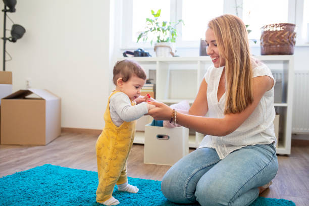 istock Mother playing with her baby on moving day 1347329288