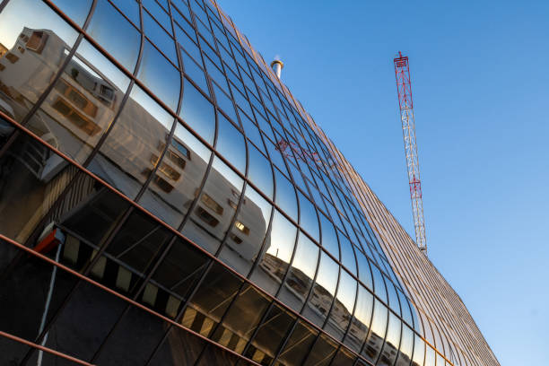 istock Reflections on a curved glass surface of a building 1347330662