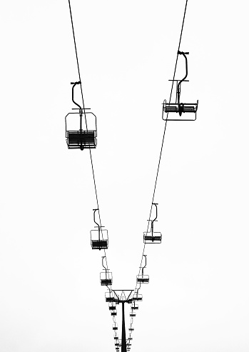 Mountain chair lift in black and white photographs