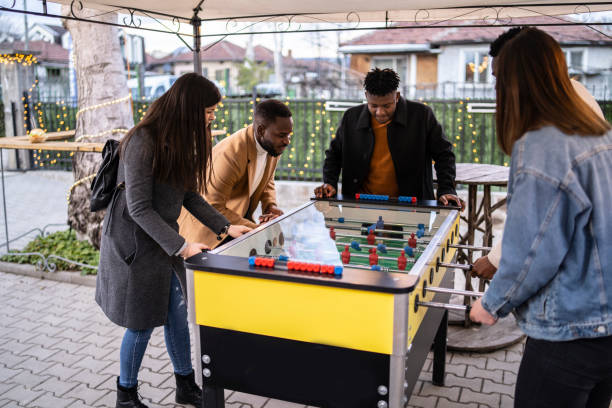 istock Friends playing soccer table and having fun 1347333727