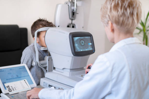 istock Ophthalmologist completing an eye test on a boy 1347333823