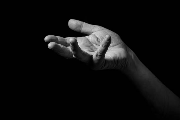 istock Male hand held out, gesturing with palm up. 1347333853