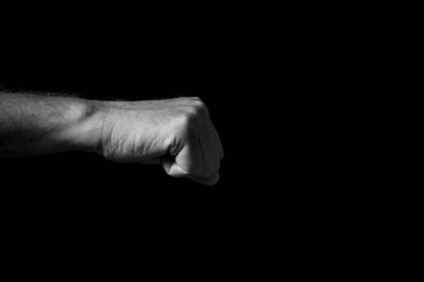 istock Male hand held out, with clenched fist. 1347333923