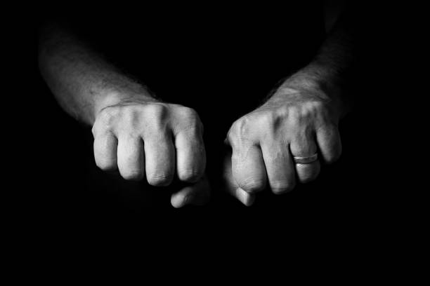 istock Male hand held out, with clenched fists. 1347333936