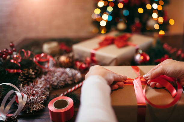 istock Woman wrapping Christmas presents 1347336561