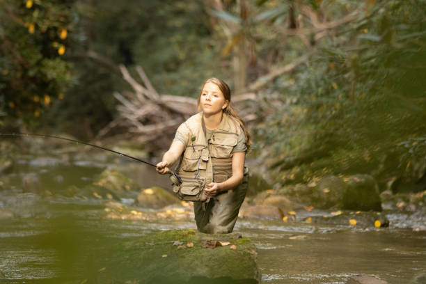 Laurinda Schenck fly fishes the cold October waters of the Green River in North Carolina.