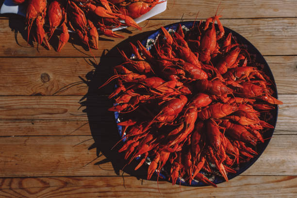 istock Red cooked crawfish and glasses of beer. 1347338532