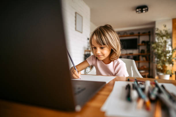 istock Schoolgirl homeschooling 1347339672