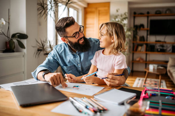istock Assisting to daughter with homework 1347339972
