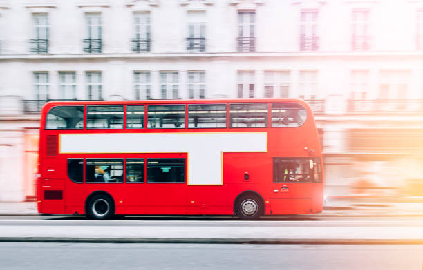 istock London Red Bus in motion with sunlight 1347340040