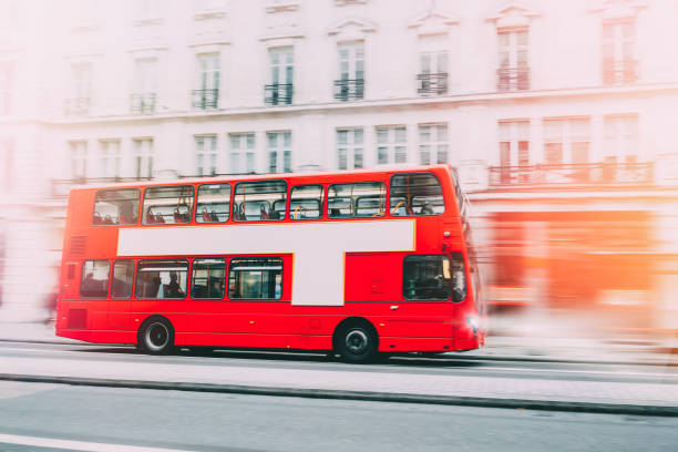 istock London Red Bus in motion with sunlight 1347340062
